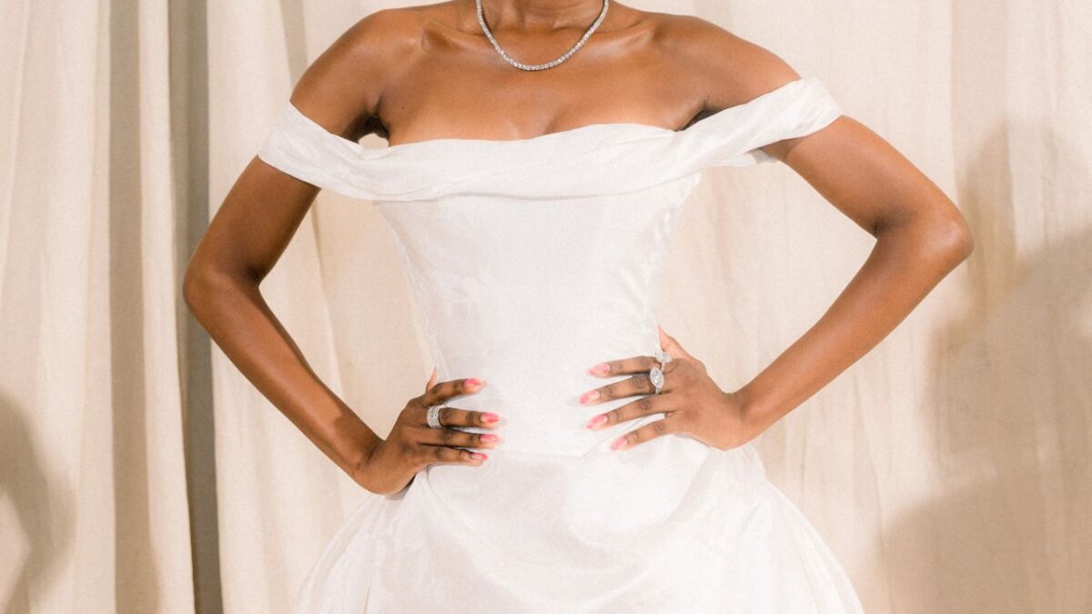 Bridal model in an off-the-shoulder white gown at the Ines Di Santo presentation