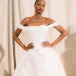 Bridal model in an off-the-shoulder white gown at the Ines Di Santo presentation