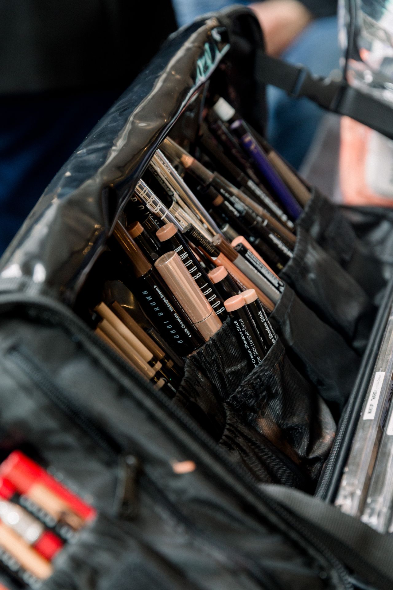 Makeup products and brushes backstage at the bridal presentation