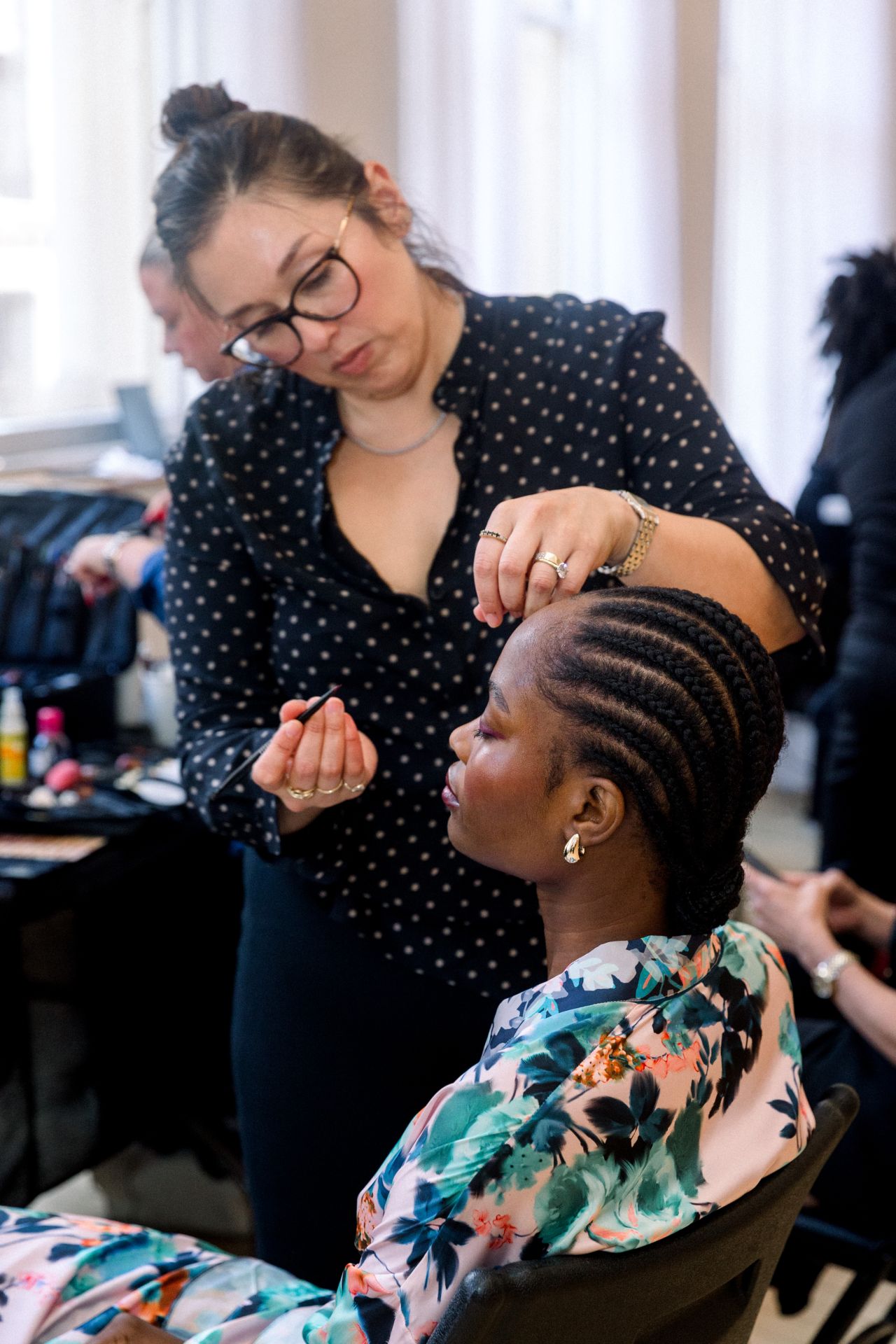 Backstage makeup application for the bridal presentation