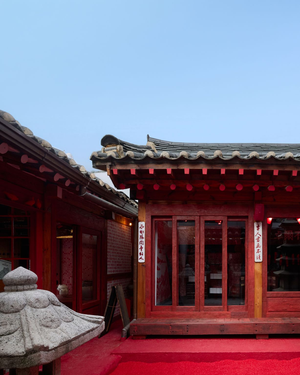 Red entrance and courtyard at the Bukchon flagship
