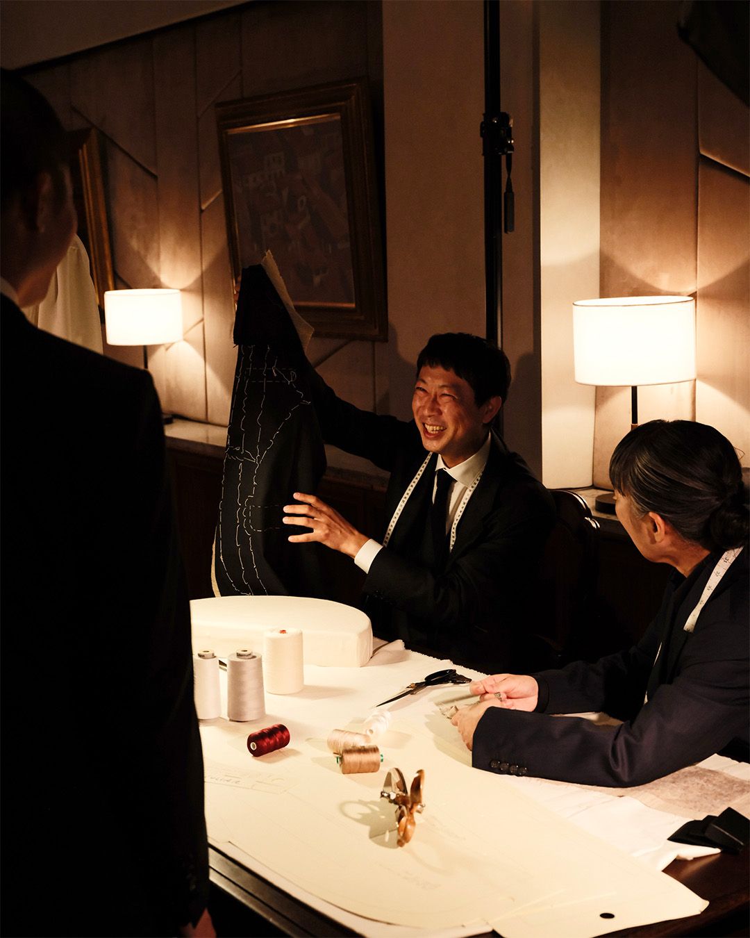 Brioni tailor demonstrates a jacket during the Tokyo Grand Tour presentation