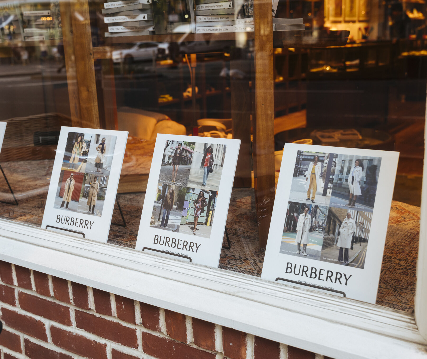 Burberry portrait publications displayed in the newsstand window