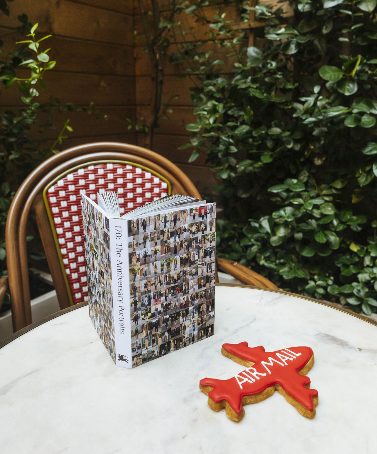 Burberry’s 170 The Anniversary Portraits publication on a cafe table