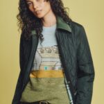 Model wearing a quilted Burberry jacket and artwork-print top from the Highgrove capsule