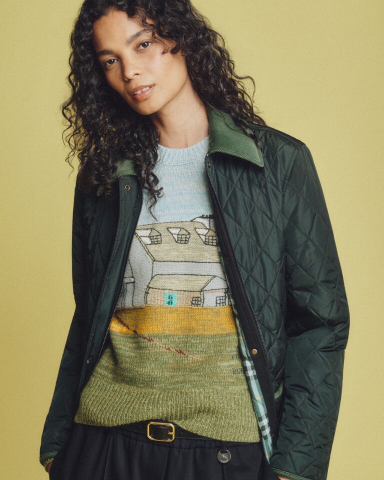 Model wearing a quilted Burberry jacket and artwork-print top from the Highgrove capsule