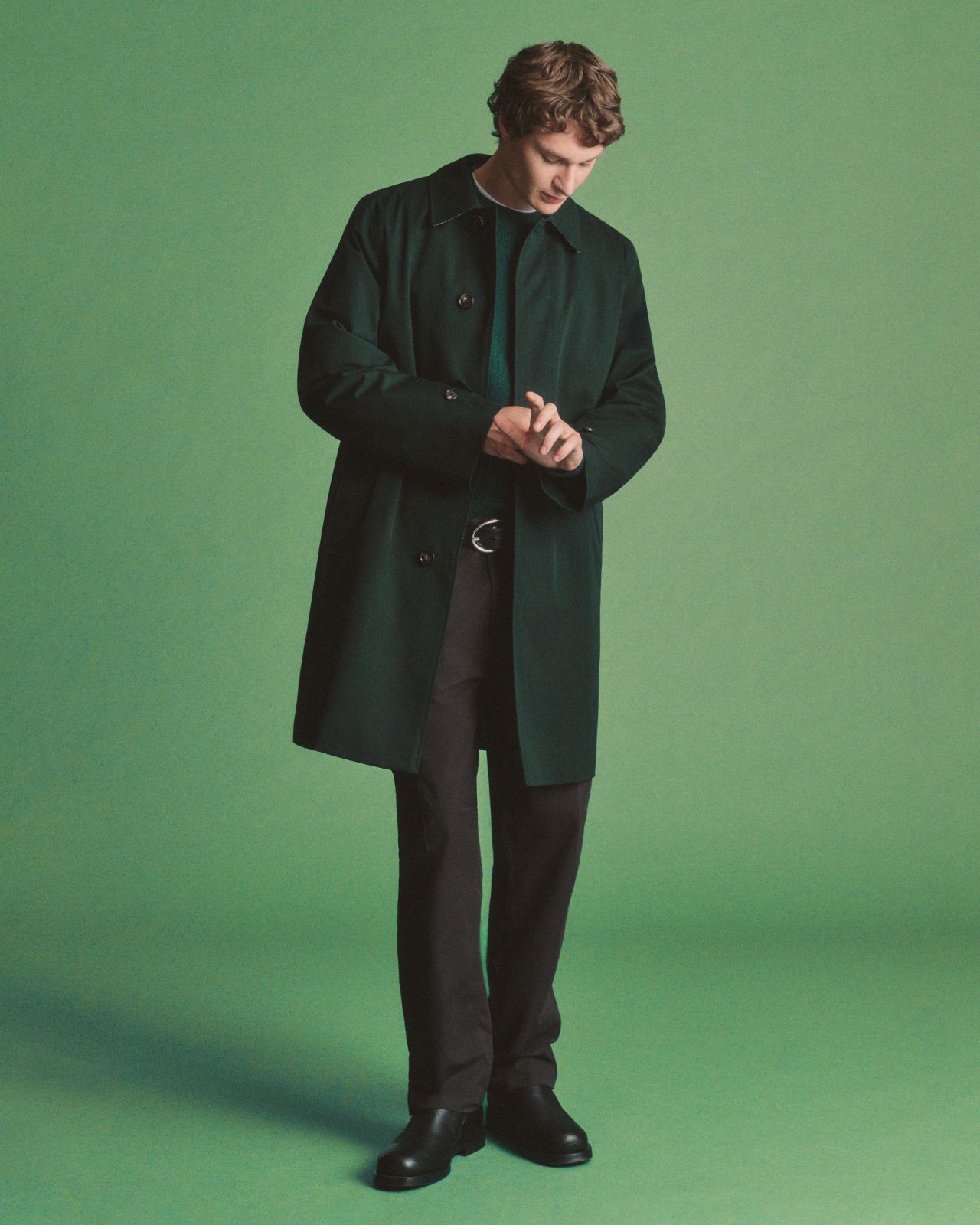 Model wearing a dark green coat from the Highgrove x Burberry collection