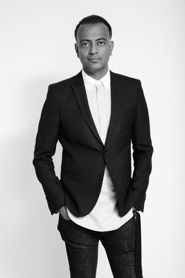 Ayub Mohamed in a black blazer and white shirt.