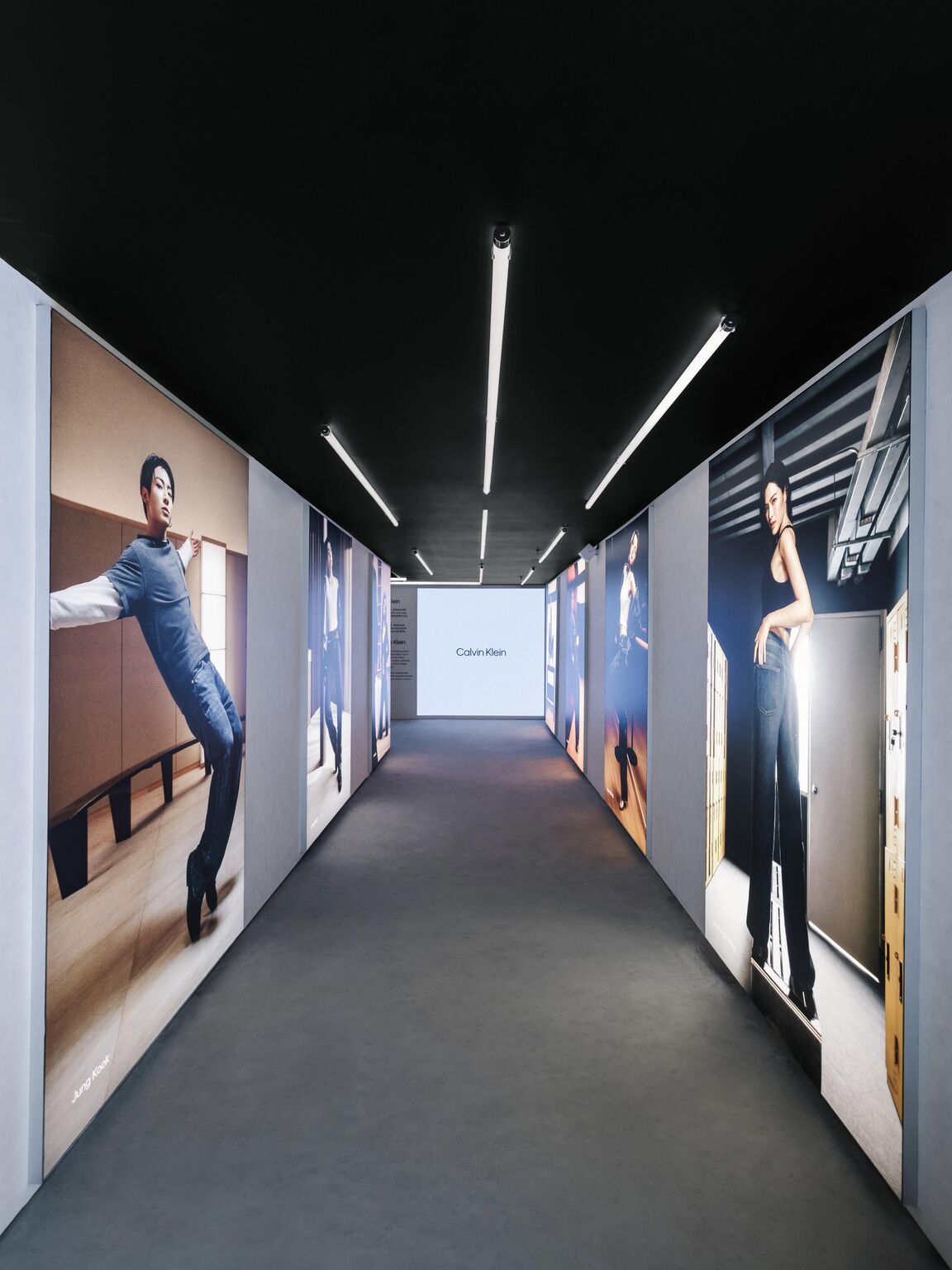 Campaign displays lining a corridor inside House of Denim
