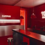 Red Campari Amer Design Lab interior and illuminated event signage in Paris