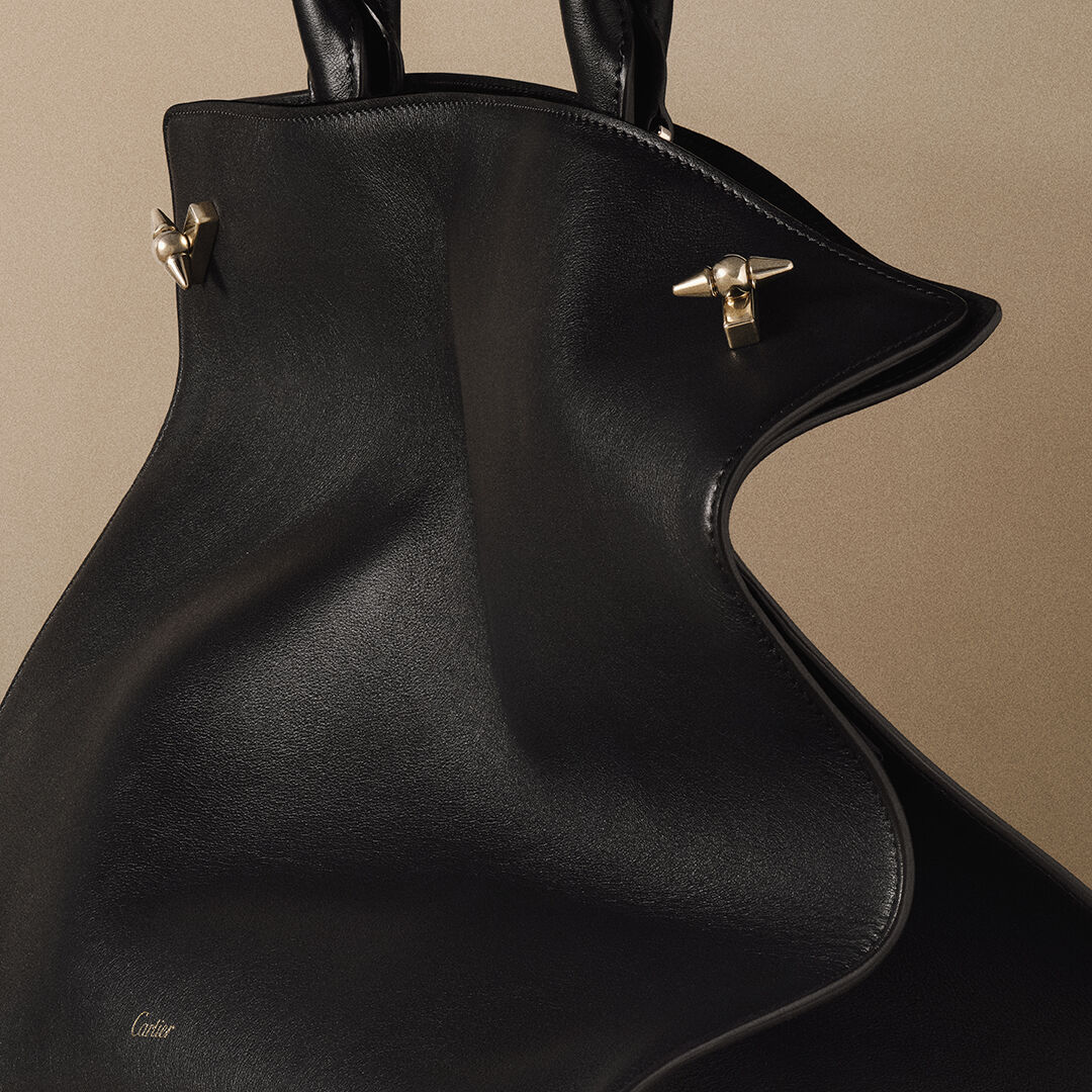 Black Clash de Cartier bag with gold-tone stud clasps