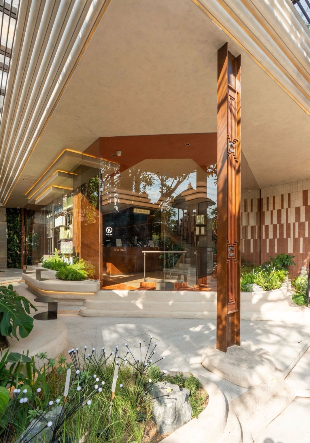 Open edge of a CHAGEE teahouse with landscaped seating