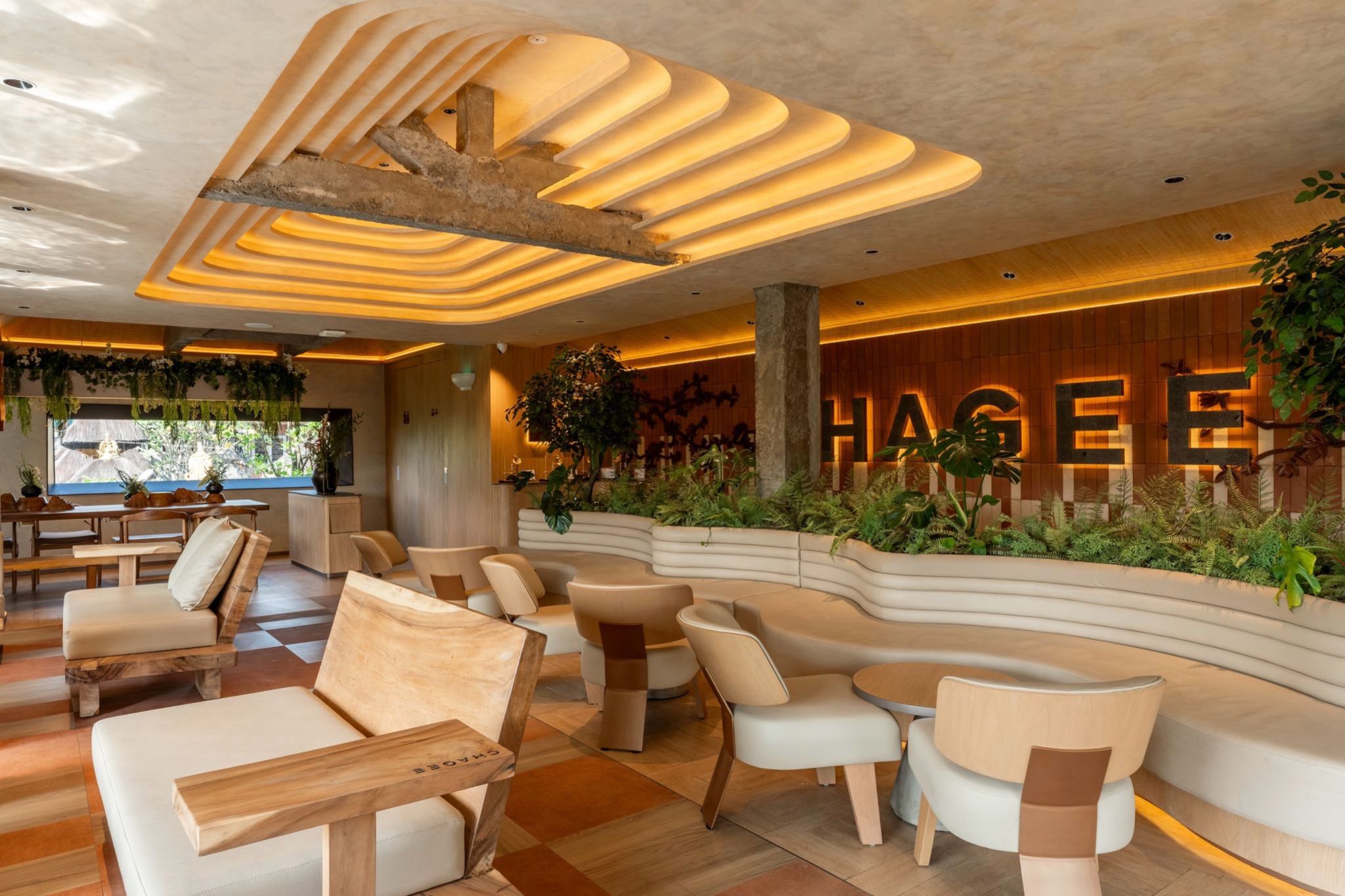 CHAGEE seating area beneath a sculpted ceiling