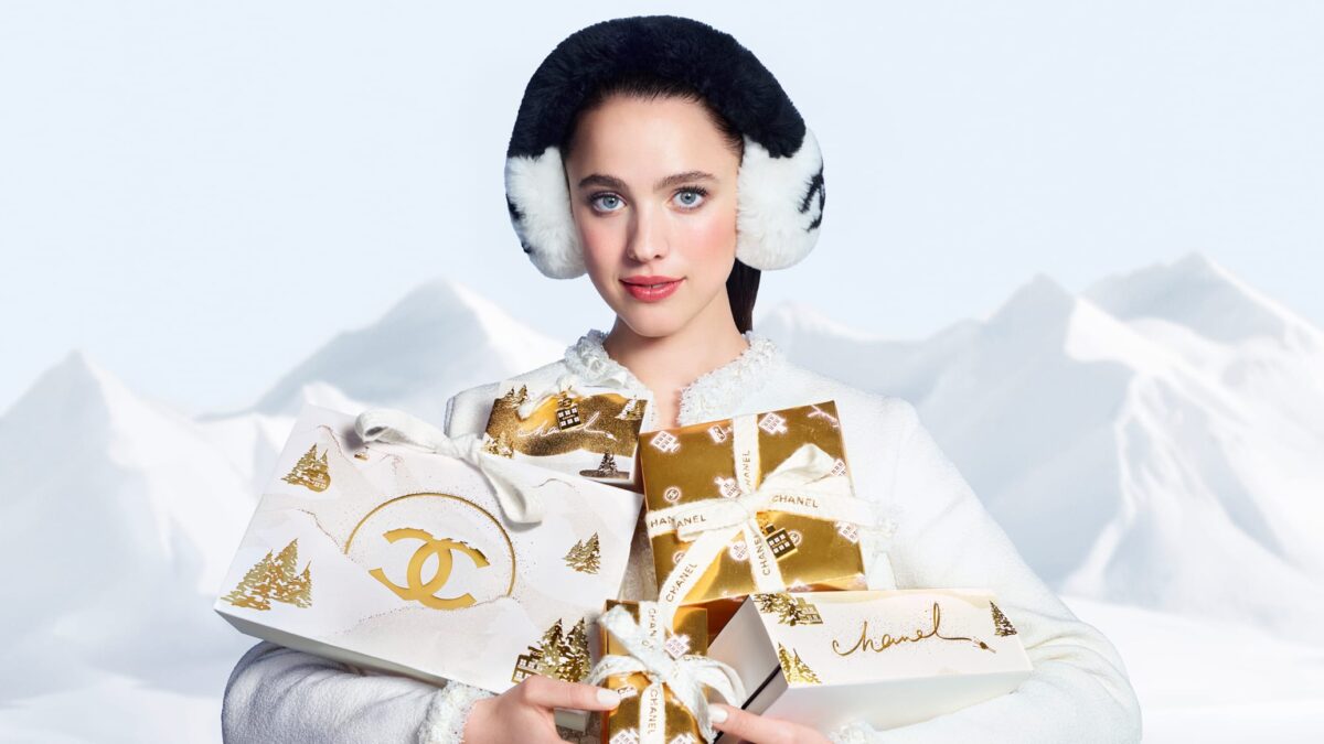 CHANEL holiday campaign portrait with gold and white gifts