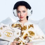 CHANEL holiday campaign portrait with gold and white gifts