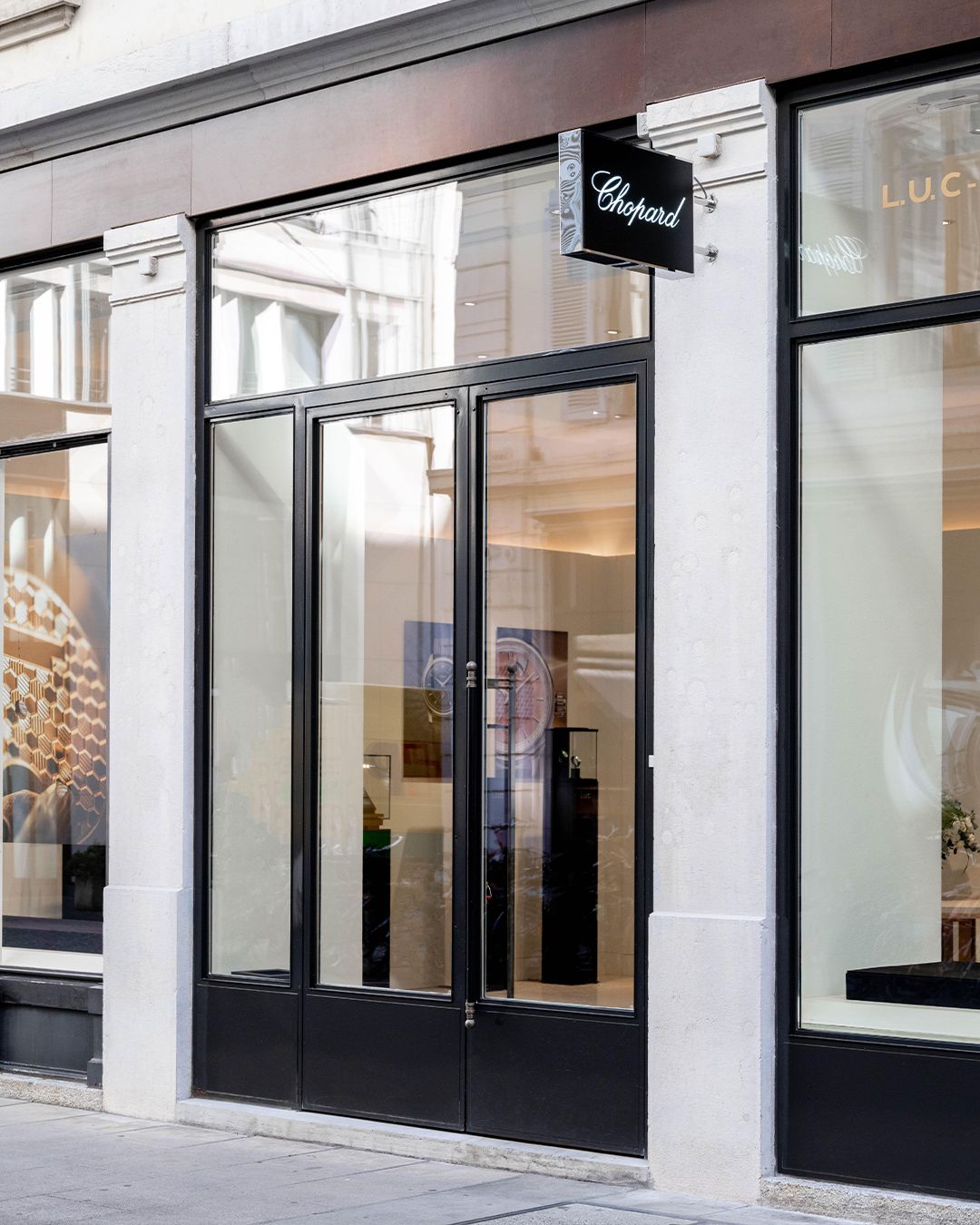 Chopard L’Art d’une Manufacture display in Geneva with watches and craft imagery