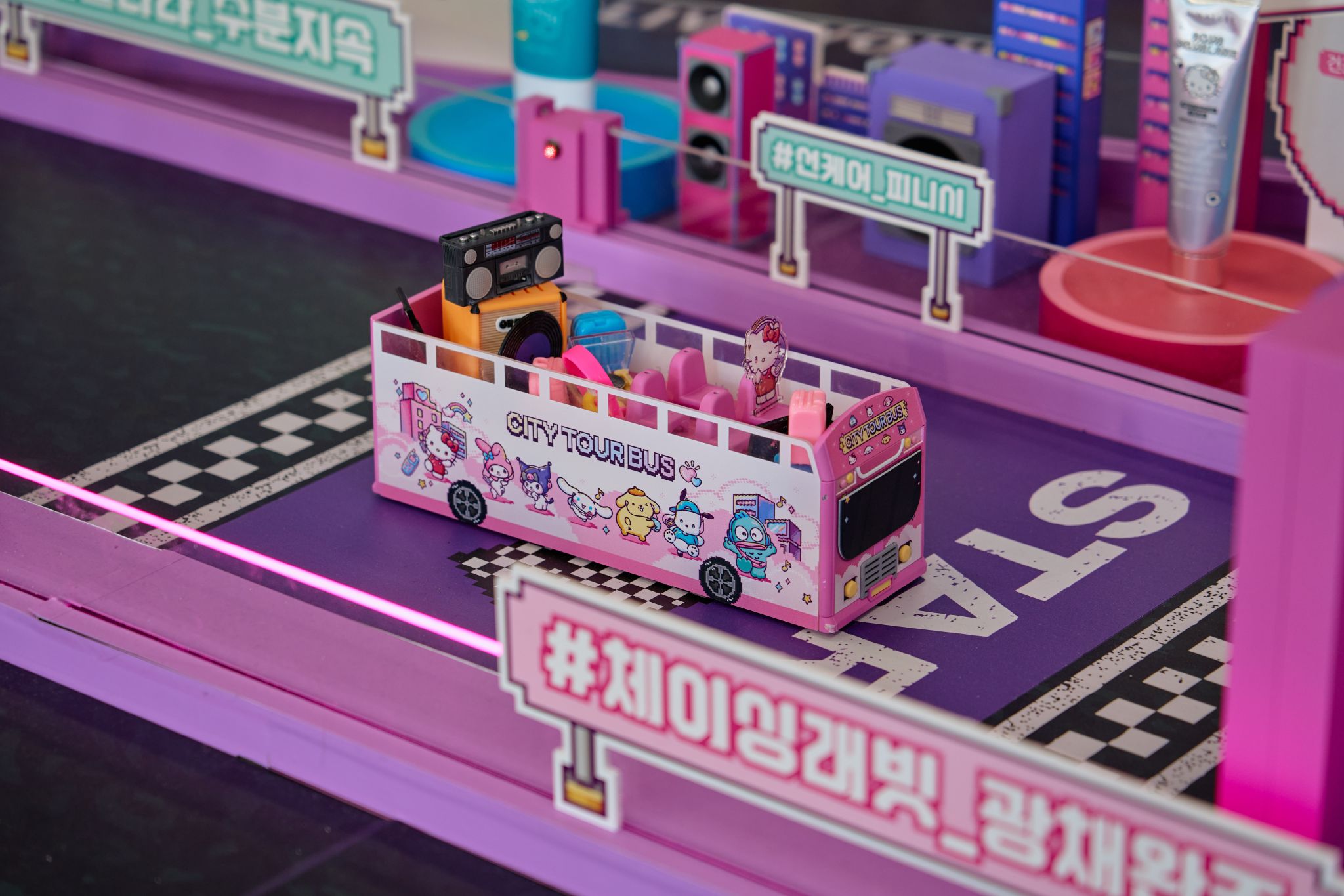 Miniature City Tour Bus interactive feature at the Olive Young Sanrio pop-up