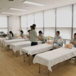 CJ Olive Young beauty consultants practice skincare service at the company's Seongsu training center