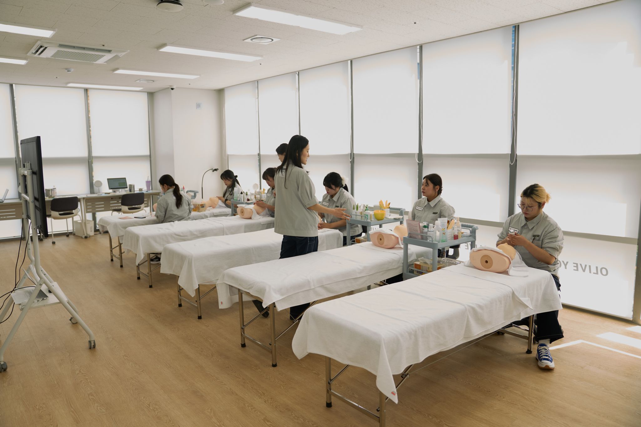 CJ Olive Young beauty consultants practice skincare service at the company's Seongsu training center