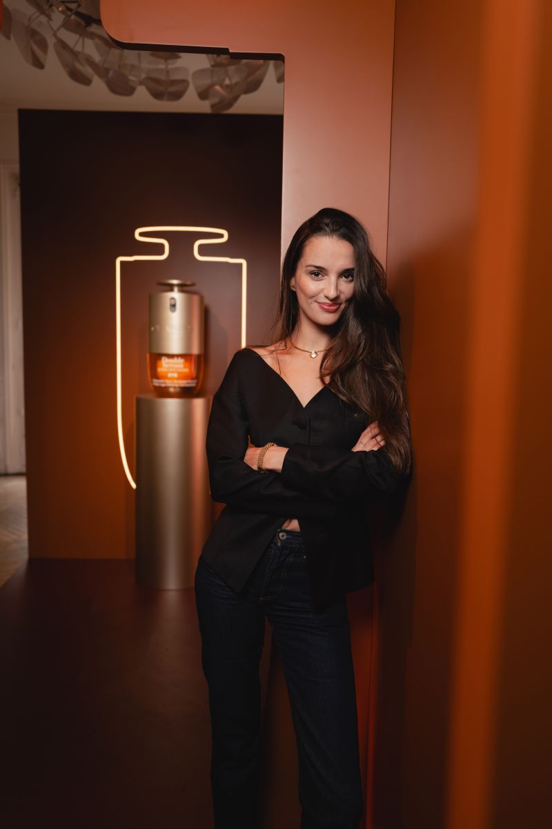 Guest beside Clarins product installations