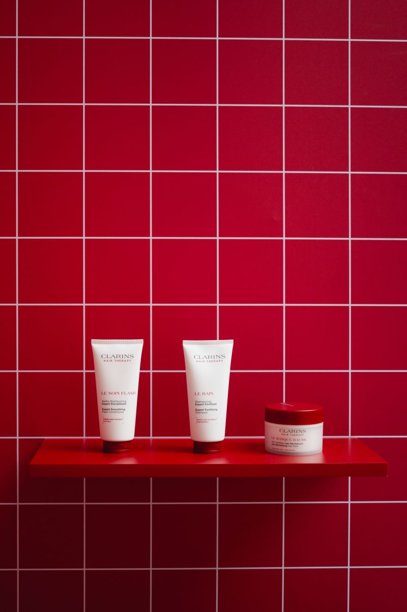 Clarins Hair Therapy product wall