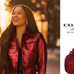 Storm Reid smiling beside Coach Cherry fragrance imagery in the 2026 campaign.