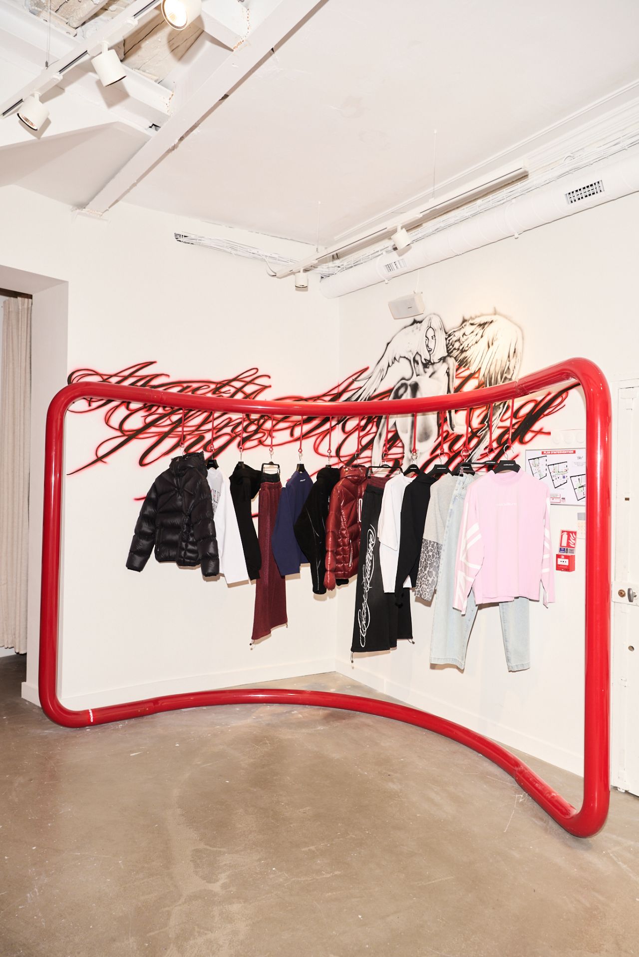Cold Culture clothing rail and mural inside its Paris Le Marais store