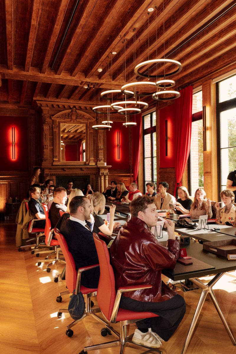 Coty Fragrance Club guests in a meeting space