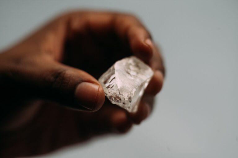A rough diamond held for inspection