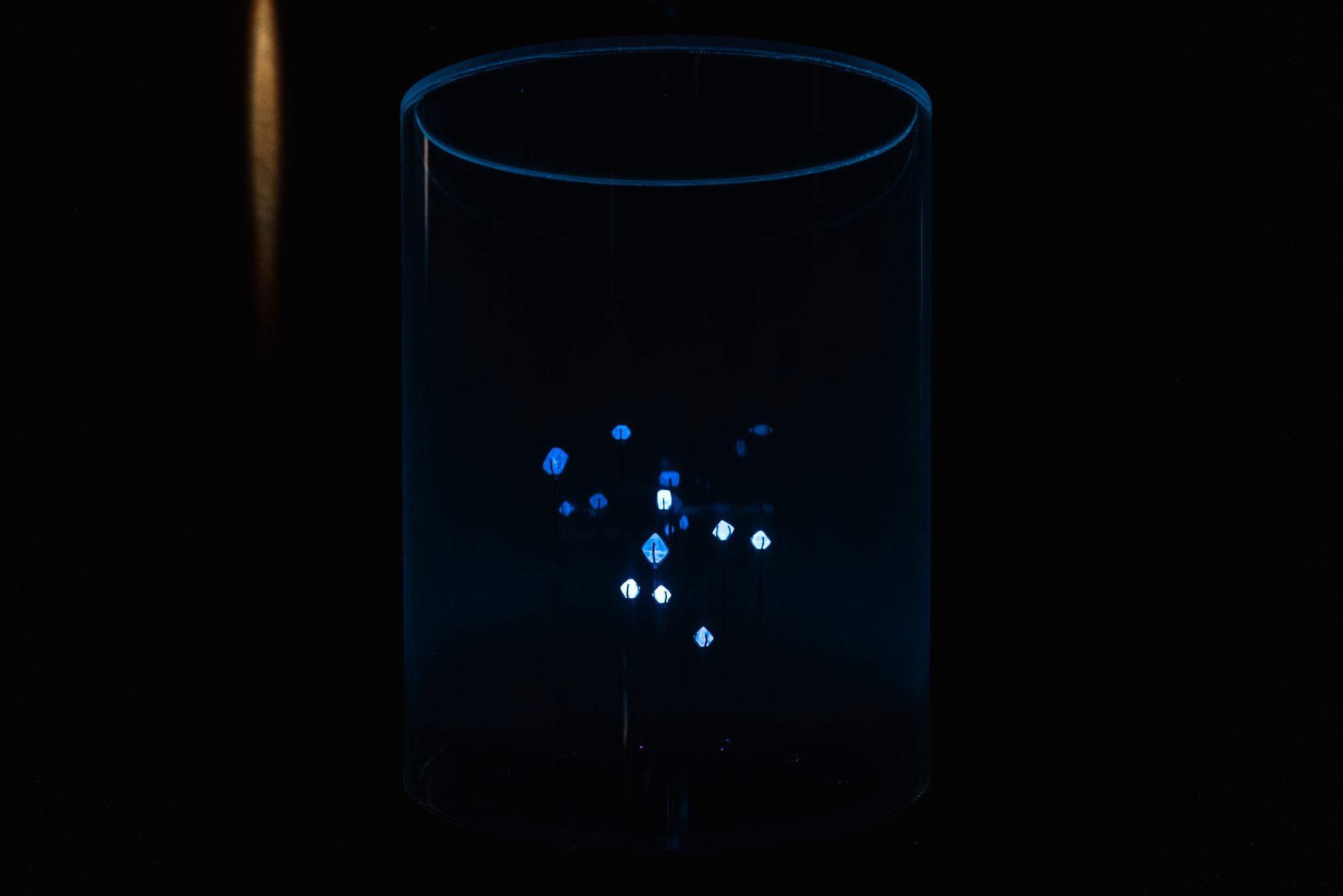 Diamonds glowing under ultraviolet light in the installation