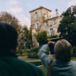 Visitors look toward Château de La Colle Noire from the gardens