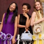 Dior Cruise 2027 campaign cast posing with handbags in a museum gallery