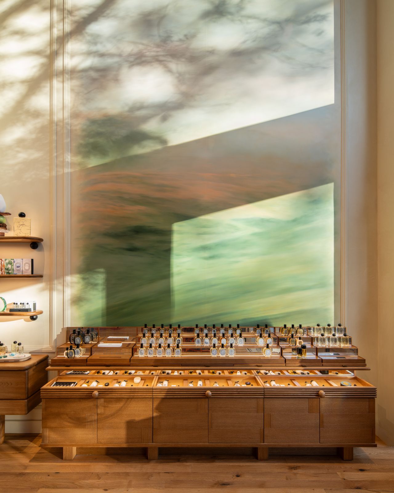 Botanical mural and fragrance counter in Diptyque’s Düsseldorf boutique