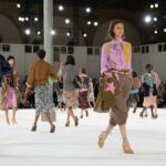 Models in colorful layered looks at the Dries Van Noten Spring Summer 2027 womenswear finale