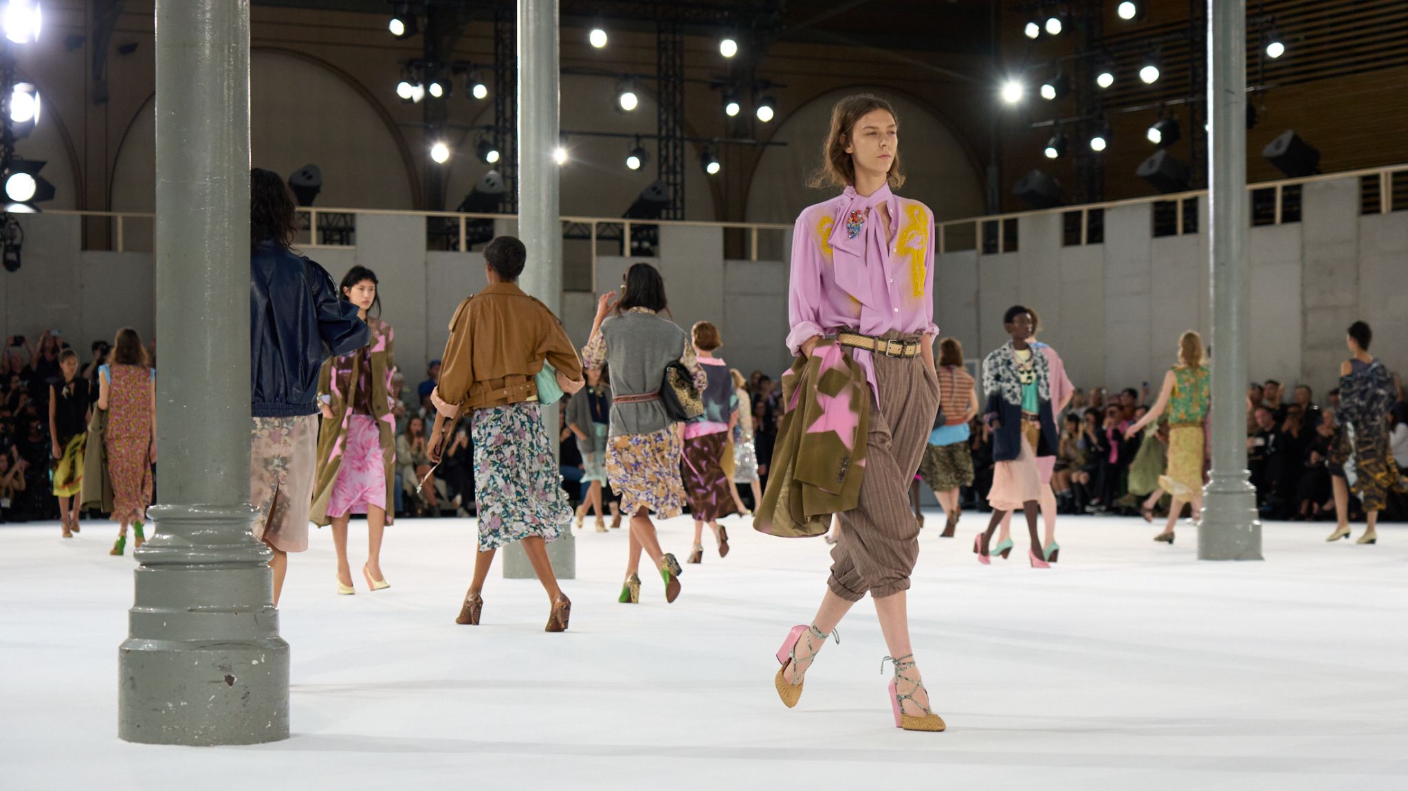 Models in colorful layered looks at the Dries Van Noten Spring Summer 2027 womenswear finale