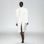 White high-collared tailored coat on the Jean Paul Gaultier runway