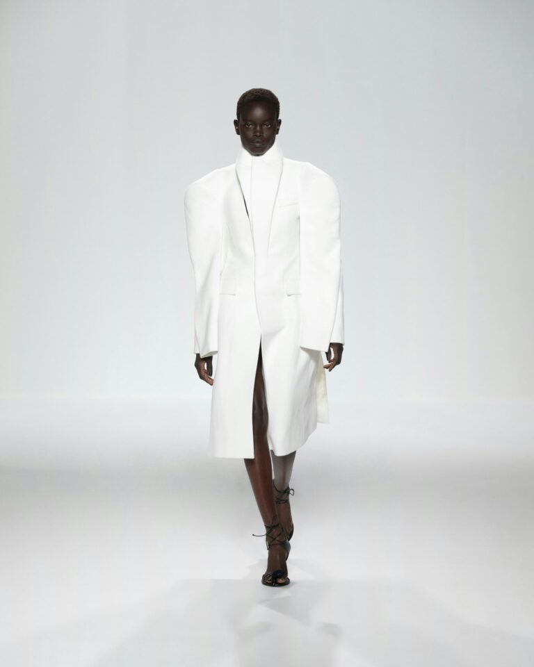White high-collared tailored coat on the Jean Paul Gaultier runway
