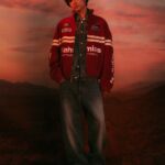 Model wearing a red NAHMIAS x Formula 1 racing jacket from the Austin capsule