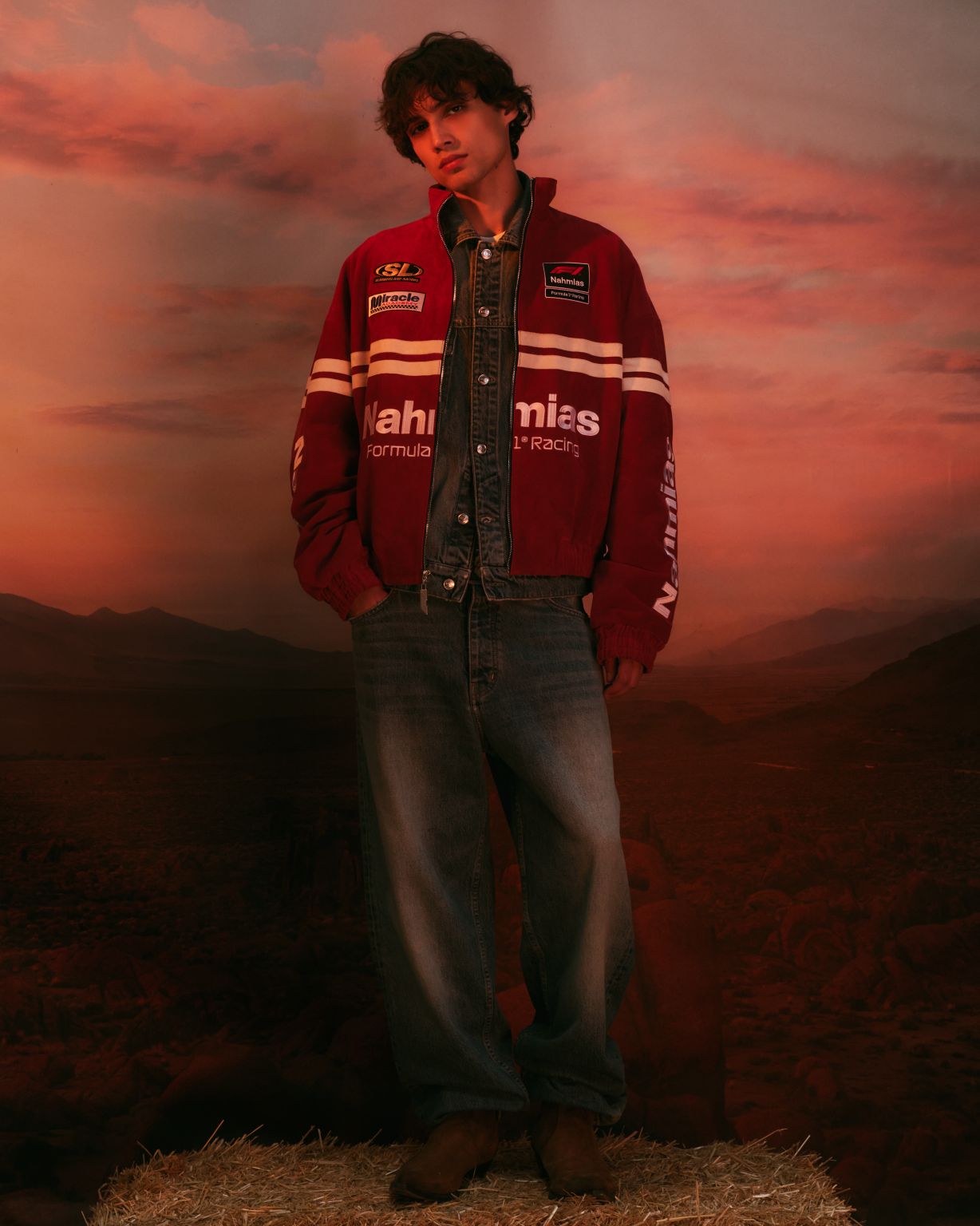 Model wearing a red NAHMIAS x Formula 1 racing jacket from the Austin capsule