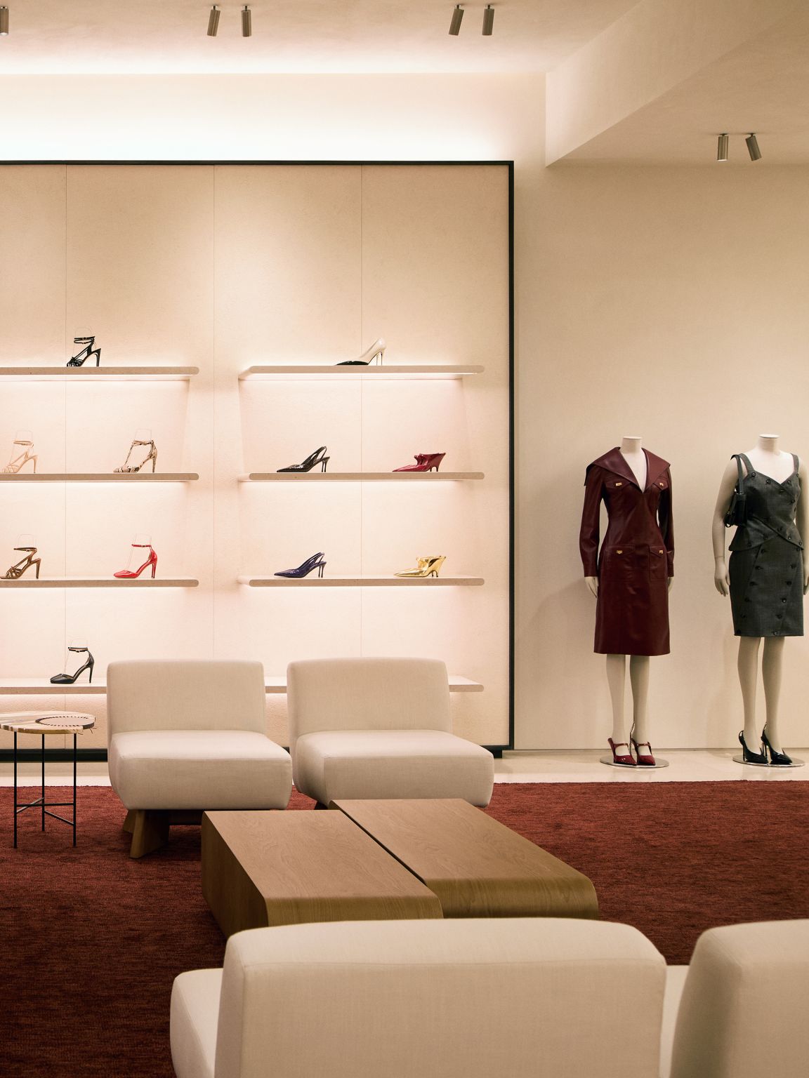 Women’s footwear and ready-to-wear display with seating