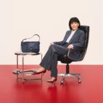 Kris Jenner seated beside a Ferragamo handbag in The Joy of Loving Holiday 2026 campaign