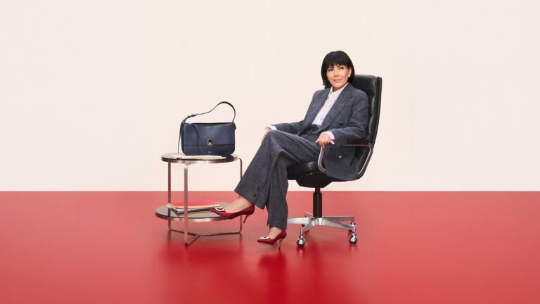 Kris Jenner seated beside a Ferragamo handbag in The Joy of Loving Holiday 2026 campaign