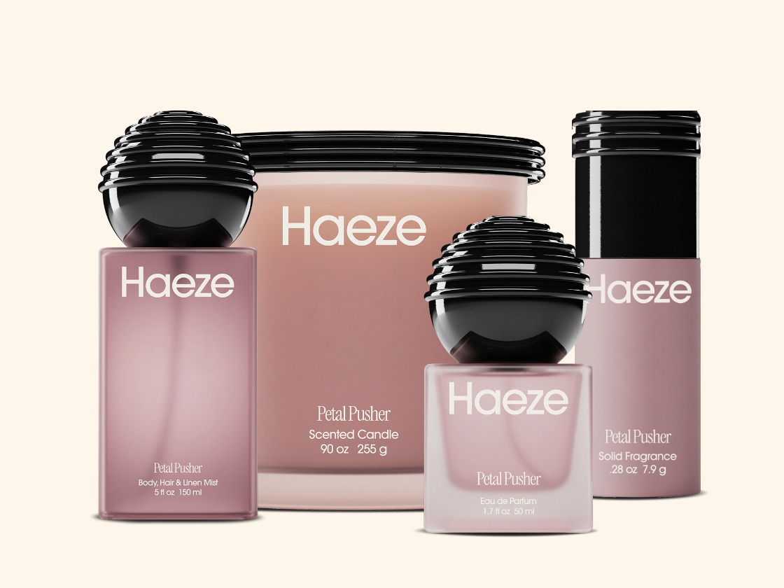 Haeze Petal Pusher fragrance bottles and matching candle in pink packaging