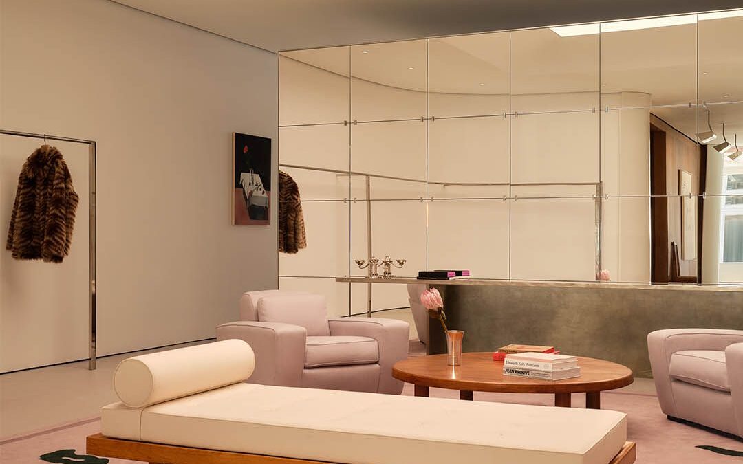 Seating and clothing displays inside the reopened FRAME SoHo flagship