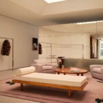 Seating and clothing displays inside the reopened FRAME SoHo flagship