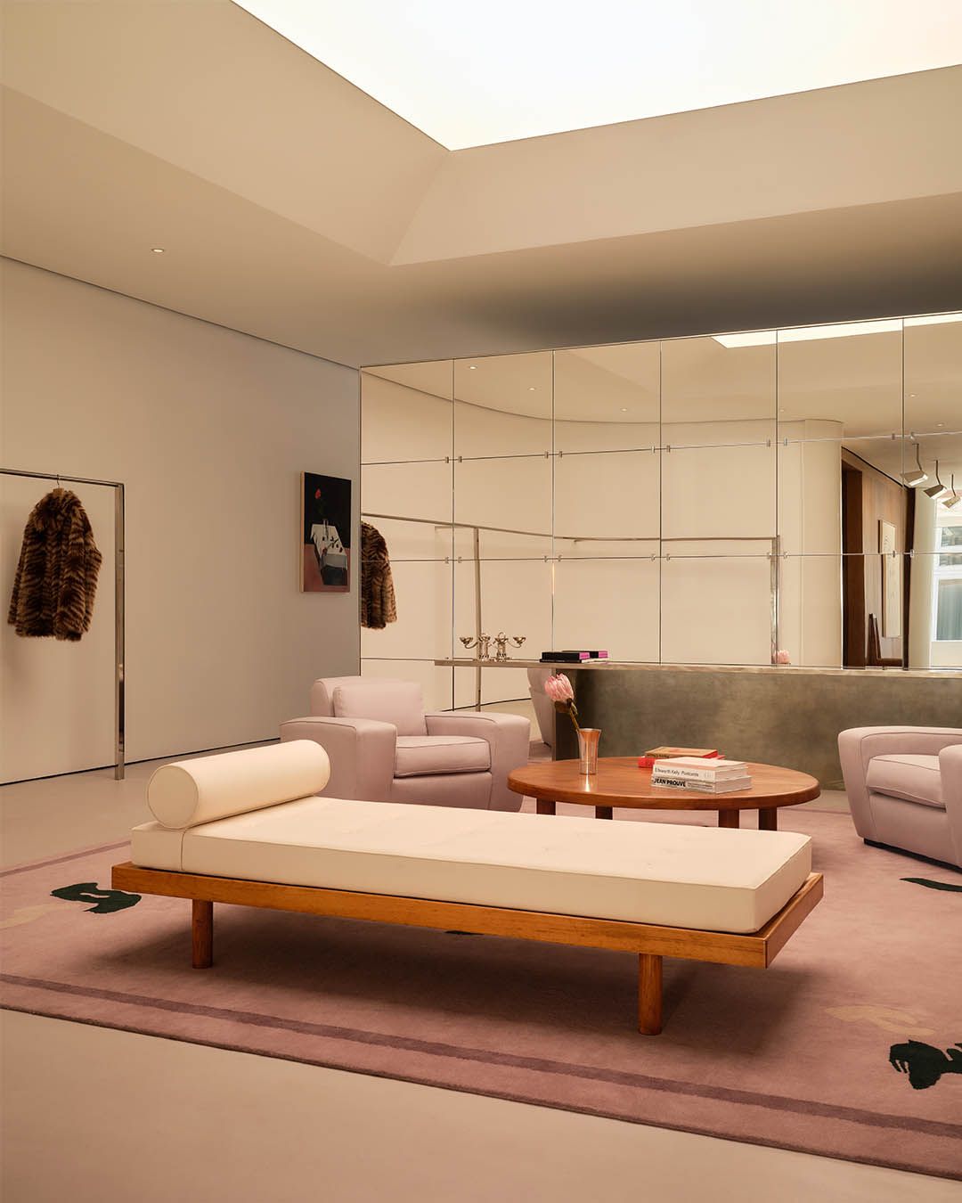 Seating and clothing displays inside the reopened FRAME SoHo flagship