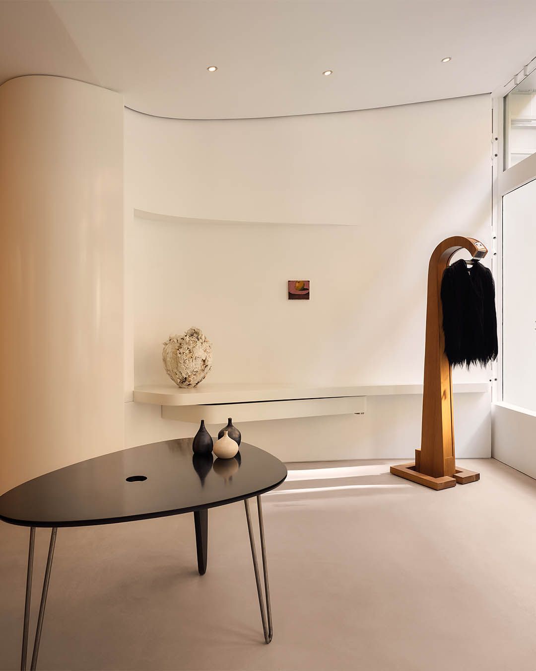 Curved wall and sculptural display table at FRAME SoHo