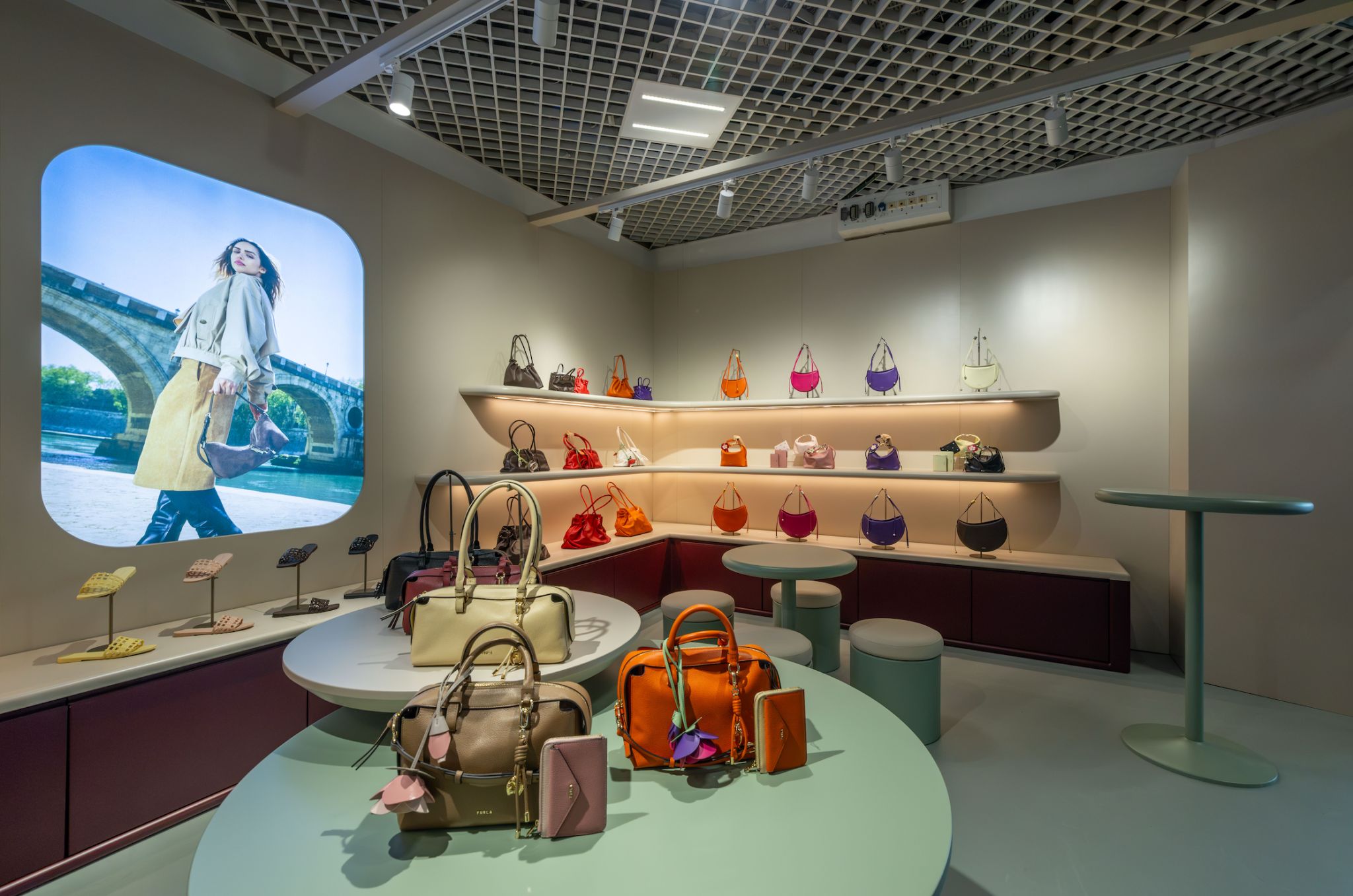 Close view of Furla handbags and campaign display at its TFWA 2026 Cannes stand