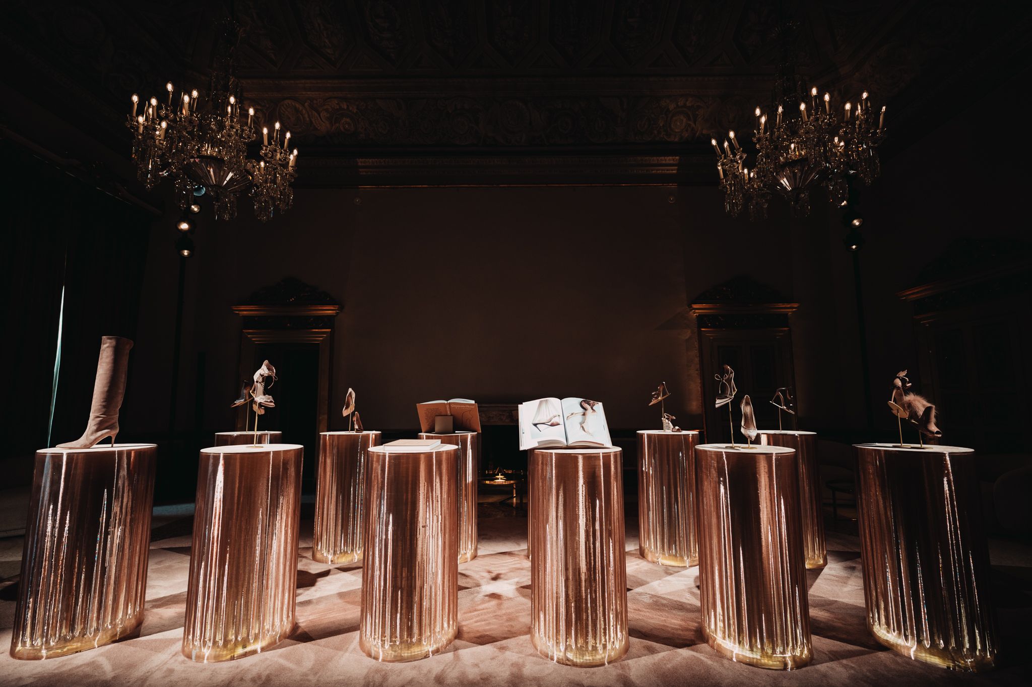 Gianvito Rossi footwear displayed on illuminated plinths in Milan