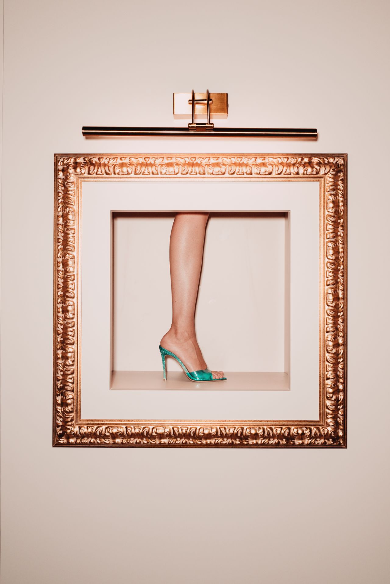 Green Gianvito Rossi sandal pictured within a decorative frame